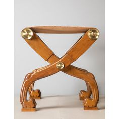 a wooden chair with two metal handles on it