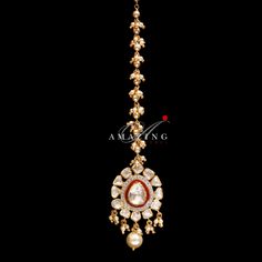 Polki Mangtika | Moissanite Polki Mangtika| Indian Traditional Mangtika | Indian Polki Mangtika | Moissanite Mangtika Material : Silver Gemstone: Moissanite, Red Enamel, Fresh Water Sea Pearls Stone colour: Uncut polki Primary colour: Gold Closure : Hook Lock Mangtika length: 90mm Mangtika width : 25mm Silver Intricate, hand crafted, Pure Silver Polki Mangtika, studded with high quality Moissanite Polki , made in 92.5 silver with 22ct gold plating. Product comes with 92.5 silver hallmark. - We a Elegant Zari Work Tikka For Puja, Elegant Ceremonial Tikka With Zari Work, Kundan Hand-set Tikka For Puja, Kundan Hand Set Tikka For Puja, Elegant Meenakari Tikka For Puja, Festive Hand Set Tikka For Puja, Festive Reception Tikka With Latkans, Kundan Temple Jewelry Tikka For Reception, Temple Jewelry Tikka For Diwali Reception