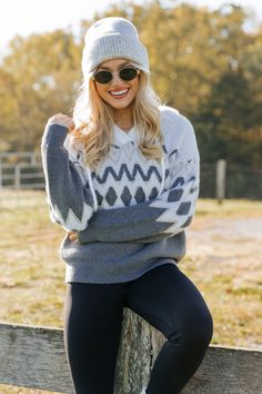 Embrace the cozy vibes of winter with our Grey Nordic Print Hooded Sweater, a perfect blend of warmth and style! Its classic Nordic print and plush feel make it an essential piece for chilly days. The V neckline and attached hood add a laid-back, casual touch, perfect for layering or wearing on its own. It's made from fuzzy material that you'll want to wear all season long. Ideal for everything from relaxing by the fire to enjoying outdoor winter adventures! Warm Winter Sweater For Outdoor, Cozy Fit Soft Knit Hoodie For Winter, Winter Sweater With Fleece Lining For Cold Weather, Cozy Soft Knit Hoodie For Cold Weather, Cozy Warm Hoodie For Winter, Cozy Winter Hoodie For Cold Weather, Cozy Gray Winter Hoodie, White Winter Sweater For Outdoor Wear, White Winter Outdoor Sweater