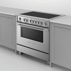 a white stove top oven sitting inside of a kitchen next to a counter and cabinets