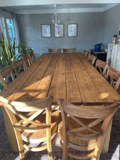 a large wooden table with chairs around it