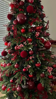 a christmas tree decorated with red and green ornaments