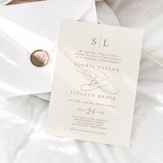 a white wedding suite with a gold button