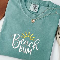 Beach Bum Shirt, Retro Comfort Colors T-Shirt, Trendy Beach Shirts for Women, Summer Vacation Shirts, Womens Oversized Beach Shirt  PLEASE NOTE THAT THE PICTURES ON THE LISTING ARE SAMPLES ONLY. If interested in adding embroidery to the sleeve please go to this listing: https://www.etsy.com/listing/1674502020 Because it is made to order, we don't accept the return or exchange unless we make a mistake We are unable to replace or refund purchases based on the color and the font selections. Please Relaxed Fit Cotton T-shirt For Vacation, Casual Cotton T-shirt For Vacation, Green Screen Print Tops For Vacation, Beachy Cotton Shirt With Relaxed Fit, Beachy Relaxed Fit Cotton Shirt, Beachy Cotton T-shirt, Pre-shrunk, Beachy Cotton Pre-shrunk T-shirt, Beachy Cotton T-shirt Pre-shrunk, Beachy Cotton T-shirt