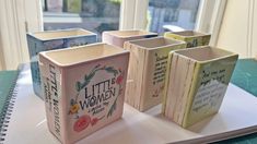 four little women books are sitting on a table next to a book with the words little women written on them