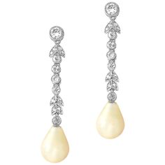 A pair of Edwardian pearl and diamond drop earrings, the natural saltwater drop shape pearls measuring approximately 11 x 8.3mm and weighing 4.28 and 4.73 carats, accompanied by a Gem & Pearl Laboratory certificate, suspended from an old- and rose-cut diamond-set foliate run, the diamonds all millegrain rubover-set in white, with screw fittings, circa 1910, the earrings measuring approximately 4 x 0.8cm, gross weight 5.49 grams. A Pair of Edwardian earrings in Good condition. Unmarked, metal tes Gem Drop Earrings, Pink Gem, Pearl And Diamond Earrings, Deco Jewelry, Diamond Drops, Diamond Drop Earrings, Pearl Diamond, Rose Cut Diamond, Pearl Drop