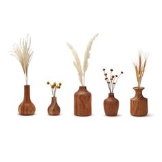 four wooden vases with dried flowers and plants in them on a white background,