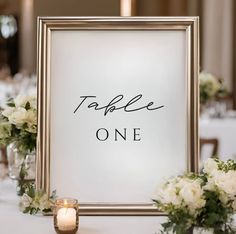 the table is set up with candles and flowers for an elegant wedding breakfast or reception