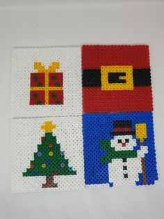 cross stitch christmas coasters with santa claus, snowman and tree on white background