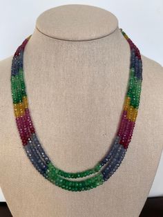 multicolored beaded necklace on a mannequin