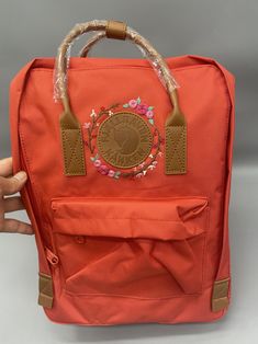 Welcome to my store and choose the perfect hand-embroidered fjallraven kanken backpack   Version & Size + Mini size: 29x20x13cm (A5 paper size) + Medium size: 27x38x13cm (15.7 inch laptop) + Big size: 35x45x15cm (17 inch laptop) - Product price includes: hand-embroidered fjallraven kanken backpack and design as shown in the picture - I can make fjallraven kanken backpack hand embroidery patterns according to your ideas - fjallraven kanken backpack will be hand embroidered with thread that won't Spring Travel Bag With Embroidered Logo, Casual Backpack With Embroidered Logo, Trendy Embroidered Backpack For Travel, Casual Backpack With Embroidered Logo For Daily Use, Kanken Backpack Embroidery, Backpack Kanken, Kanken Embroidery, Backpack Embroidery, Embroidered Lavender