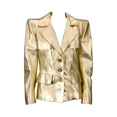 Iconic YSL Jacket in Gold kid leather with extreme pagoda shoulders circa 1985. Gilt Bronze flowerhead buttons by Goosens. Black silk charmeuse lining. Crafted by YSL Haute Couture. Iconic is an often used term. This jacket is testament to the power chic of the 1980's jet set. Ex Collection: Fashion Icon Tina Chow See "Flair:Fashion Collected by Tina Chow" Richard Martin,Harold Koda, Rizzoli Pg.138-139 Size 6-8 US Leather Blazer Outfits, Ysl Haute Couture, Gold Leather Jacket, Vintage Fashion 80s, 80s Clothing, Celebrities Leather Jacket, Yves St Laurent, 80s Jacket, Gold Jacket