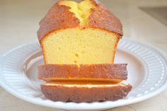 a white plate topped with a loaf of pound cake