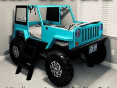 a blue jeep bed in the corner of a room