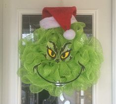 a grin face wreath hanging on the front door