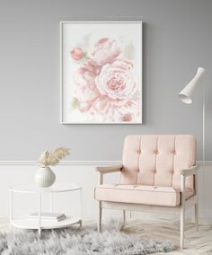 a living room with a pink chair and white rug