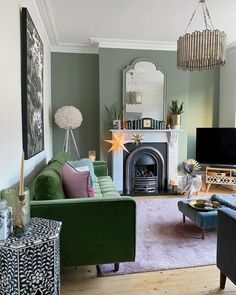 a living room filled with furniture and a fire place in front of a flat screen tv