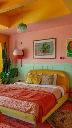 a bedroom with pink walls and orange bedding, potted cacti on the wall