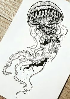 a black and white drawing of a jellyfish on a piece of paper with ink