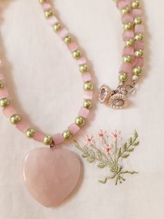 "Pink/rose quartz square/cube beads and minty green Swarovski crystal pearls alternate on a 24\" necklace with a pink/rose quartz heart pendant. Silver magnetic clasp Heart pendant is a generous 35mm x 35mm necklace length 24\" Please don't hesitate to contact me should you have any questions or concerns. Thank you for visiting my shop and I look forward to you visiting again soon. 12418" Beads Ideas, Cube Beads, Pink Rose Quartz, Quartz Crystal Pendant, Minty Green, Rose Quartz Pendant, Healing Necklace, Rose Quartz Heart, Rose Quartz Necklace