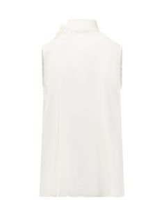 Sleeveless blouse. High neck with bow detail. Button closure.Composition: 70% Acetate, 30% Silk Formal Sleeveless Top With Bow, Elegant Summer Daywear Vest, Elegant Sleeveless Blouse With Bow, Elegant Spring Tank Top With Bow, Silk Top With Bow For Workwear, Silk Tops With Bow For Workwear, Elegant Bow Tank Top For Spring, Silk Workwear Top With Bow, White Sleeveless Tank Top With Bow