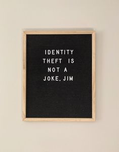 a black and white sign that reads identity thief is not a joke, j m