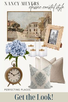 a blue and white living room with pictures on the wall, pillows and a clock