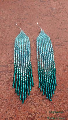 These handmade earrings are made of high-quality Czech beads and strong synthetic thread. They are elegant, fashionable, and highly versatile, suitable for everyday wear. Color: turquoise, emerald, teal . 100% hand made with love! Measurements: Length-about 11.5cm (4.33 inch) Width -about 2 cm (0.79 inch) Materials: Sterling silver components Czech glass beads Nylon Thread Beaded Fringe Dangle Jewelry For Beach, Green Beaded Long Drop Jewelry, Green Beaded Fringe Jewelry For Summer, Blue Beaded Dangle Earrings For Beach, Beach Dangle Jewelry With Beaded Fringe, Turquoise Beaded Long Drop Earrings, Turquoise Beaded Fringe Chandelier Earrings, Teal Beaded Earrings, Green Fringed Beach Jewelry