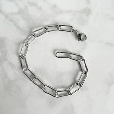 Larger link paperclip chain bracelet, in hypoallergenic stainless steel, which will not tarnish and is great for those with a sensitivity to metals! DETAILS * stainless steel chain with 17x7mm links * 15mm stainless steel lobster clasp Smaller link chain also available! https://www.etsy.com/listing/1199174836/stainless-steel-paperclip-bracelet?click_key=1a9f03fe8756a9fce6475840d5ecb4ee4c632cf5%3A1199174836&click_sum=2a64581f&ref=shop_home_active_1&frs=1&crt=1&sts=1 *Please measure accurately! Br Modern Metal Bracelets With Paperclip Chain, Metal Paperclip Bracelet With Chunky Chain Link, Modern Metal Bracelet With Paperclip Chain, Minimalist Metal Chain Bracelet With Rectangular Links, Minimalist Metal Chain Bracelet With Oval Links, Minimalist Metal Link Chain Bracelet, Metal Paperclip Bracelet With Chunky Oval Link, Everyday Silver Chain Link Paperclip Bracelet, Modern Metal Paperclip Bracelet With Adjustable Chain