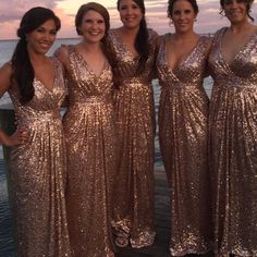 the bridesmaids are all dressed in gold sequins