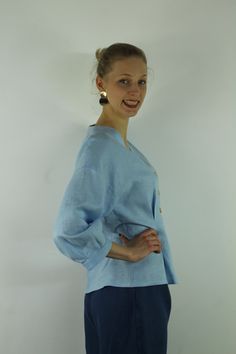 "Write the selected color in the message Handmade sky blue V neck linen blouse with front buttons and long sleeves, perfect for casual wear and suitable for any occasion in any season Details: - 100% natural linen produced in Europe ; - medium weight (180 gram per square meter); - color: sky blue, could be any from our colors catalog (color samples at the photo); Made to order, approximately a few days, If you have any questions please message me and I will be glad to answer. Size guide : Size X Linen Apron Pinafore, Color Catalog, Summer Linen Dresses, Linen Casual, Summer Linen, Linen Blouse, Blue V, Square Meter, Wrap Blouse