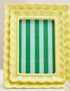 a small yellow and green striped square frame