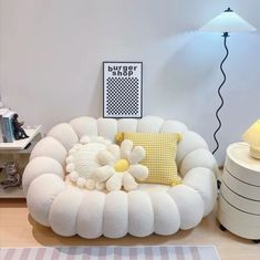 a living room with a flower shaped chair