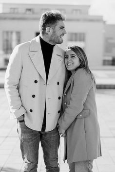 a man and woman standing next to each other