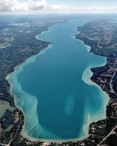 an aerial view of the water and land