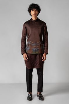 A coco brown neheru jacket embroiderd with ektar work using resham showing the famous artist Vangoghs Stary night. The jacket is paired with a same brown color kurta with pintuck detailing. [sizecharts id=26278] Designer Raw Silk Kurta With Long Sleeves, Designer Raw Silk Long Sleeve Kurta, Designer Long Sleeve Raw Silk Kurta, Silk Nehru Jacket For Festivals With Long Sleeves, Designer Long Sleeve Sherwani For Fall, Brown Fitted Long Sleeve Kurta, Designer Straight Kurta For Fall, Fitted Long Sleeve Kurta With Tonal Embroidery, Festive Long Sleeve Brown Kurta