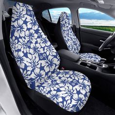 the interior of a car with blue and white flowers on it's seat covers