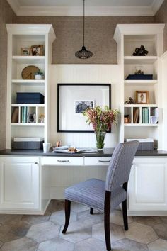 an image of a home office with built in shelving and desks on the wall