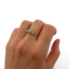 This beautiful ring combines the elegance of gold-filled silver with the vibrant charm of turquoise stones. Perfect as a protection amulet or a special gift, this handmade piece is a stunning addition to any jewelry collection. Why You'll Love This Ring: Gold Filled Silver: Combines the luxurious look of gold with the durability of 925 silver. 3 Turquoise Stones: Adds a pop of color and is believed to offer protection and positive energy. Handmade: Each ring is crafted with care and attention to Turquoise Three Stone Ring For Gift, Turquoise Three Stone Ring As A Gift, Handmade Personalized Gifts, Protection Amulet, Turquoise Stones, Beautiful Ring, Jewelry Lover, Ring Gold, Turquoise Stone