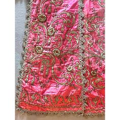 A stunning antique Turkish silk satin robe having rich embellishments of raised hand-embroidered floral motifs in metallic thread, with additional accents of beads and metal sequins on a delicious shade of shimmering pink, it is a beautiful colour pop room decor.  Circa 1850 - 1899. Framed in acrylic shadow box. Pink Raw Silk Fabric With Zari Embroidery, Pink Silk Embroidered Fabric With Zari Work, Bollywood Style Dupatta With Gold Embroidery For Traditional Ceremonies, Pink Raw Silk Fabric With Traditional Drape, Pink Raw Silk Embroidered Fabric With Traditional Drape, Pink Raw Silk Embroidered Fabric In Traditional Drape, Pink Silk Thread Embroidered Fabric With Dupatta, Pink Silk Thread Embroidered Dupatta Fabric, Pink Silk Thread Embroidered Fabric For Diwali