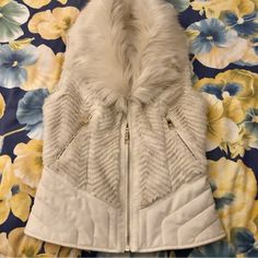 Guess Gorgeous Faux Fur Zip Up Vest. Creamy Off White Color. Beautiful Satin Lining With Two Back Tie Ups. This Looks As Though It Is Brand New. Excellent Condition If Not. It Is Not Leather But It Looks Like It. Stunning Vest. Size Xs Zip Up Vest, Off White Color, Cream White, White Color, Ups, Faux Fur, Zip Ups, Jackets & Coats, Jackets For Women