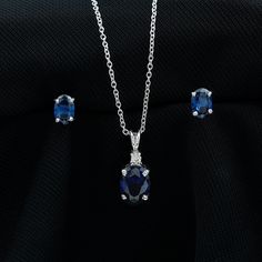 Product Details Introducing our remarkable jewelry set, featuring a pendant necklace adorned with an oval-shaped created blue sapphire, elegantly complemented by a round moissanite accent. Accompanying this stunning pendant are a pair of earrings showcasing oval created blue sapphires. Prepare to steal the spotlight with this truly enchanting collection. Product Information SKU SHP-PENDANT012148436 Length 12 mm Width 6 mm Weight 3.04 gm (Approximate) LAB CREATED BLUE SAPPHIRE INFORMATION No.of S Luxury Sapphire Oval Pendant Jewelry, Formal Sapphire Sterling Silver Jewelry Sets, Elegant Gemstone Jewelry Sets, Sapphire Jewelry Sets For Gifts, Formal Sapphire Diamond Jewelry Sets, Elegant Sapphire Jewelry Sets In Sterling Silver, Elegant Sapphire Sterling Silver Jewelry Sets, Elegant Sapphire And Diamond Jewelry Sets, Sapphire Oval Pendant Jewelry With Diamond Accents