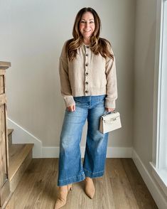 Midsize Fall outfit | tan button down cardigan | wide leg denim jeans | tan booties | cream purse Wide Leg Denim Outfit Fall, Cream Denim Outfit, Cream Purse Outfit, Mid Size Wide Leg Jeans Outfit, Cream Jeans Outfit Fall, Wide Leg Cuffed Jeans Outfit, Wide Cropped Jeans Outfit, Evereve Outfits, Tan Jeans Outfit