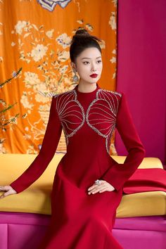 Elevate your style with our exquisite Ao Dai. The luxurious velvet fabric, coupled with the high neck and A-line silhouette, creates a stunning look that exudes sophistication and elegance. Perfect for special occasions and events, this ao dai is sure to make you stand out. Length: 150cm (Ao Dai), 110cm (Pants) Elegant Red Evening Dress For Winter, Elegant A-line Winter Evening Dress, Elegant Winter A-line Evening Dress, Fitted Dress With Stand Collar For Festive Events, Elegant Winter Dress With Stand Collar, Elegant Festive Velvet Dress, Winter Party Dress With Stand Collar, Elegant Long Sleeve Evening Dress For Red Carpet, Elegant Festive Evening Dress For Red Carpet