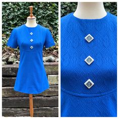 An adorable 1970s mini dress, featuring large square buttons up the front and a sash in the back. I've washed this cutie, and it's ready to wear!  It's in excellent homemade vintage condition with no flaws to note. I think it's been hemmed shorter at some point.  Measurements  Bust: 35-36 inches  Empire waist: up to 31 inches  Hips: up to 38 inches  Total length: 32 inches  Modeled on a 34/26/35 mannequin, and it fit well.  From a smoke and pet free home. I ship Monday, Wednesday, and Friday. I do not offer returns, so please reach out with any questions or to ask for additional photos/measurements. Groovy Disco Party, Space Age Dress, Royal Blue Mini Dress, Dress With Buttons, Blue Mini Dress, Disco Party, 70s Vintage, Space Age, Dress Clothes For Women