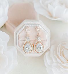 These gorgeous crystal wedding drop earrings in a teardrop design are head-turners and a magical wedding accessory for your big day! #brides #bridalstyle #weddingaccessories #winkofpinkshop #weddingearrings #bridaljewelry #bridalearrings #rosegold #earrings #weddingjewelry Rose Gold Diamond Crystal Earrings For Wedding, Rose Gold Cubic Zirconia Drop Bridal Earrings, Elegant Rose Gold Teardrop Earrings With Cubic Zirconia, Rose Gold Teardrop Bridal Earrings For Anniversary, Rose Gold Pear-shaped Teardrop Earrings For Wedding, Rose Gold Teardrop Cubic Zirconia Earrings, Rose Gold Cubic Zirconia Teardrop Earrings, Rose Gold Cubic Zirconia Teardrop Earrings For Gift, Rose Gold Crystal Teardrop Earrings