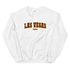 A sturdy and warm sweatshirt bound to keep you warm in the colder months. The Las Vegas Vintage Style Varsity Letter Crewneck Sweatshirt is a pre-shrunk, classic fit sweater that's made with air-jet spun yarn for a soft feel and reduced pilling. * 50% cotton, 50% polyester * Pre-shrunk * Classic fit with no center crease * 1x1 athletic rib knit collar with spandex * Air-jet spun yarn with a soft feel and reduced pilling * Double-needle stitched collar, shoulders, armholes, cuffs, and hem While w Basic Crew Neck Top For College, Basic Crew Neck Tops With Lettering, Varsity Style Crew Neck Top With Letter Print, Crew Neck Tops With Lettering For College, College Crew Neck Tops With Letter Print, Basic Crew Neck Sweatshirt With Letter Print, Varsity Style Tops With Letter Print And Crew Neck, Varsity Tops With Relaxed Fit And Lettering, Varsity Style Tops With Letter Print And Relaxed Fit