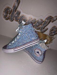 Custom Bling Converse All Star Chuck Taylor Sneakers. All designs handmade and embellished with a variety of high quality crystals. Great for weddings, proms, homecomings, birthdays, special events or just your everyday girly girl. **IF YOU NEED THIS ITEM BEFORE THE PROJECTED SHIPPING TIME YOU MUST CONTACT US BEFORE ORDERING (additional charges may apply) ** Shoe Details: Classic White high top Converse All Star Chuck Taylor Sneaker (Cloth material style) Shoe Size: Toddler kids size 2C to Big k Bedazzled Converse, Sparkly Converse, Quinceanera Shoes, Converse Wedding, Tenis Converse, Bedazzled Shoes, Bridal Sneakers, White High Top Converse, Bling Converse