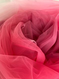 a close up view of the center of a pink tulle