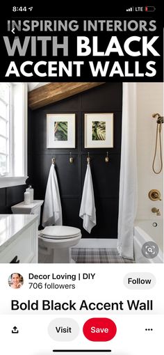 a bathroom with black accent walls and white fixtures